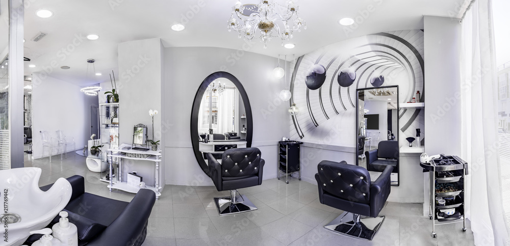 Panorama of a modern bright beauty salon. Hair salon interior business with  black and white luxury decor. Stock Photo | Adobe Stock