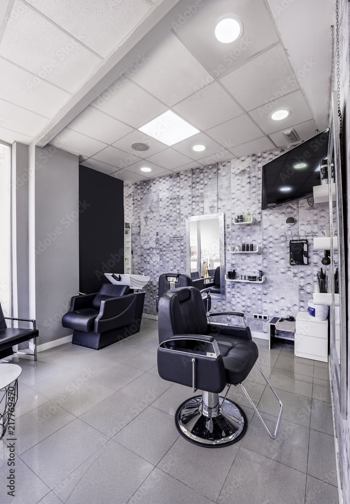 Modern bright beauty salon or baber shop. Hair salon interior business with  black and white luxury decor. Detail of the chair and mirror Stock Photo |  Adobe Stock