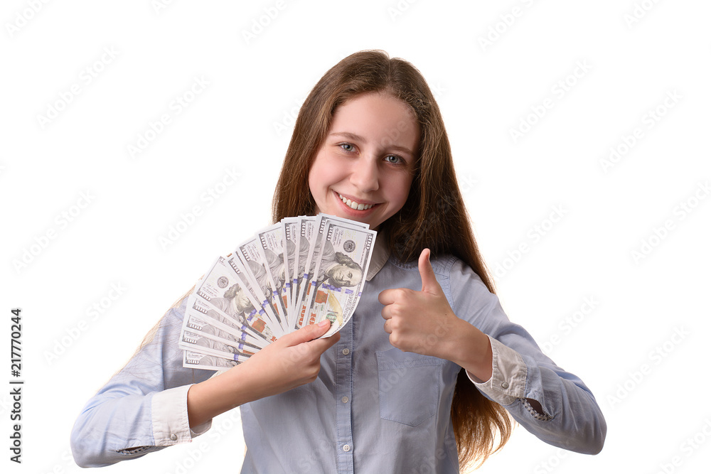 Beautiful girl holding dollars in hands. Isolated on white background. Beautiful girl holding dollars in hands. Isolated on white background.