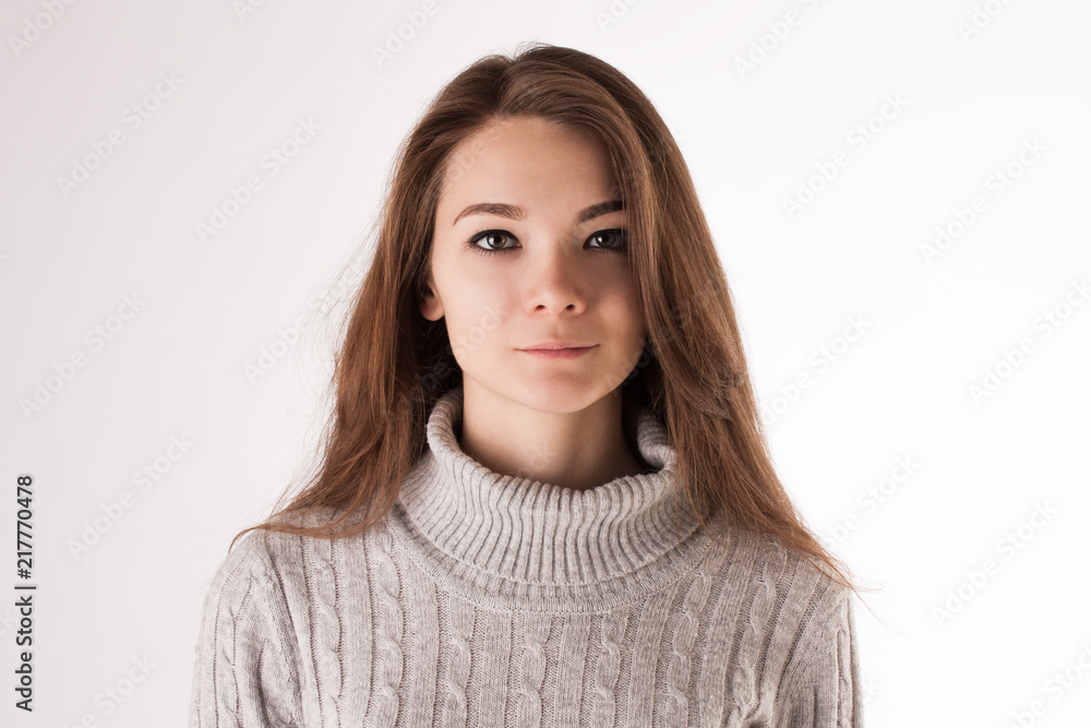 Portrait of a young attractive girl in casual cloth on white studio background Portrait of a young attractive girl in casual cloth on white studio background