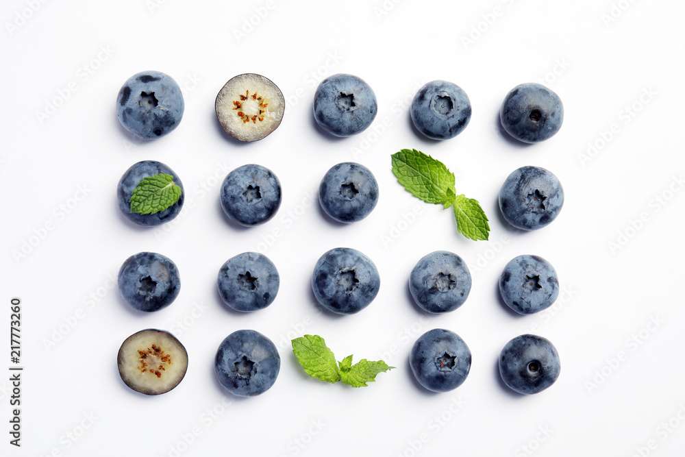 Flat lay composition with tasty blueberry on white background Flat lay composition with tasty blueberry on white background