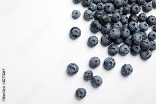 Flat lay composition with tasty blueberry and space for text on white background