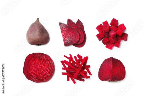 Composition with whole and cut beets on white background, top view