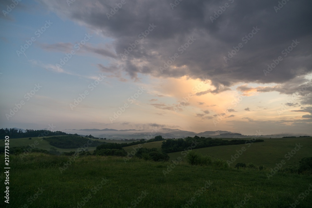 Obraz premium Sunrise and sunset over the hills and town. Slovakia