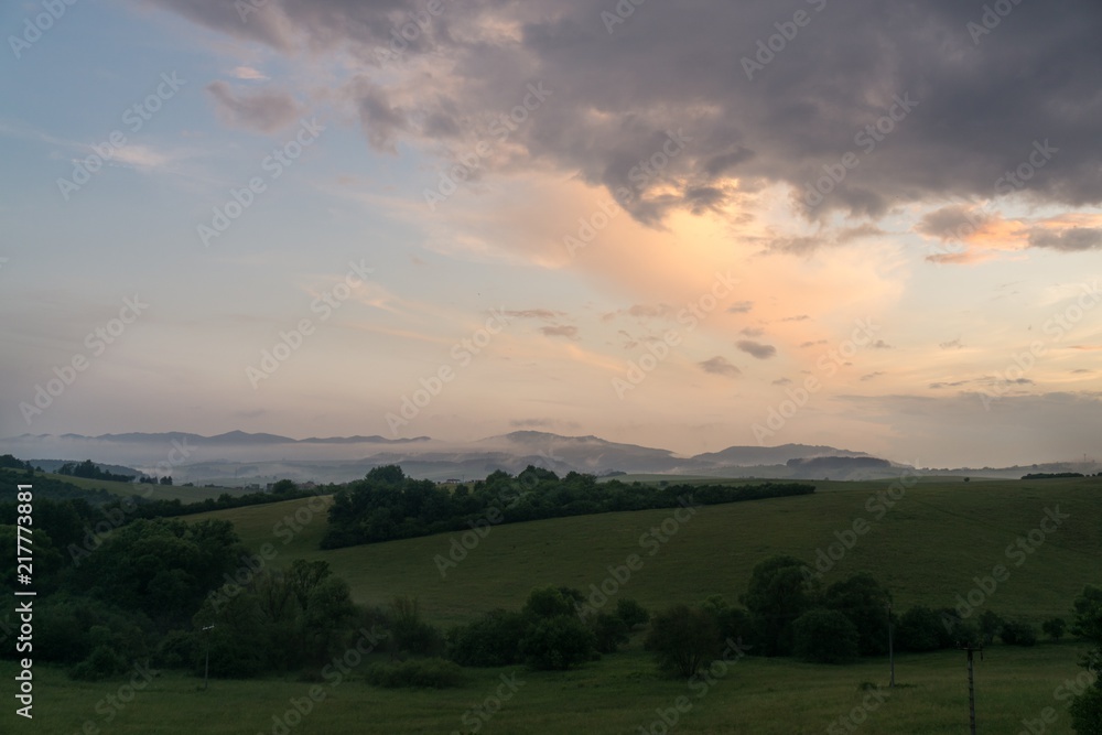 Obraz premium Sunrise and sunset over the hills and town. Slovakia