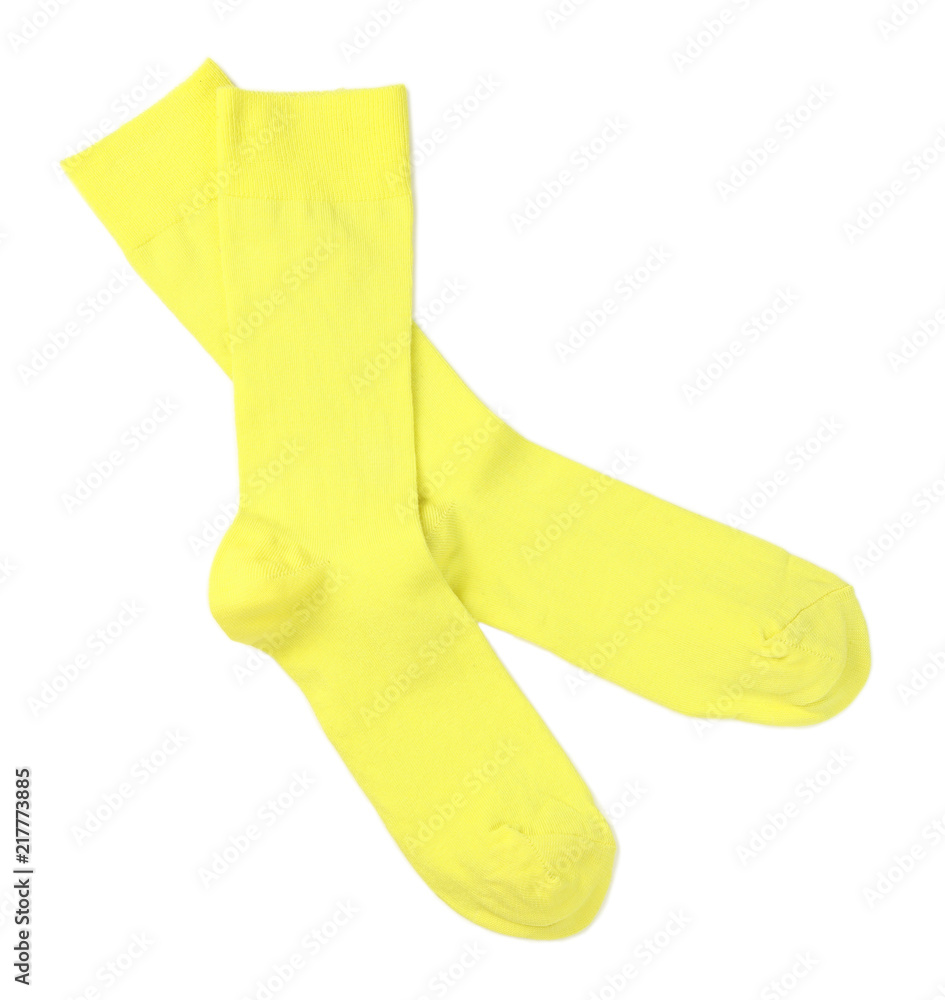 Yellow socks on white background, top view Yellow socks on white background, top view