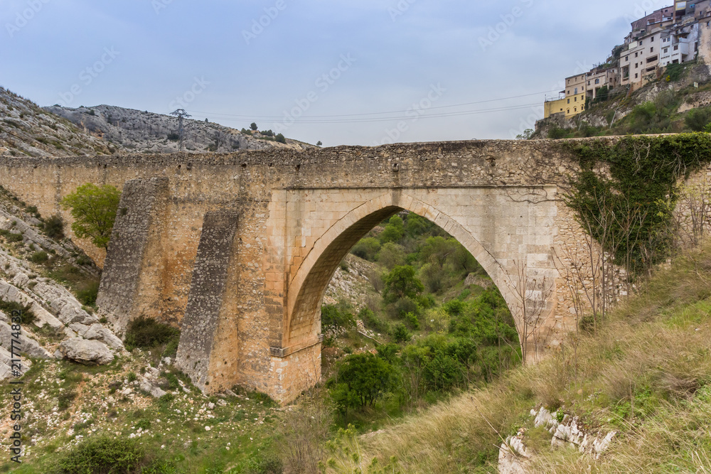 Old roman bridge in historic town Bocairent, Spain