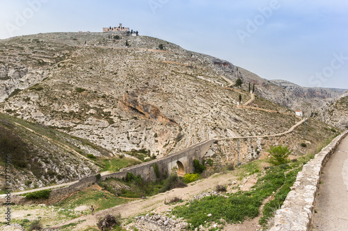 Roman bridge and road to the monastery in Bocairent, Spain photo