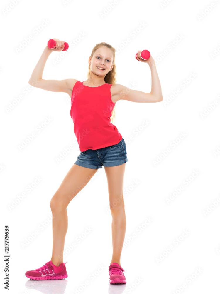 Little girl doing exercises with dumbbells. Little girl doing exercises with dumbbells.