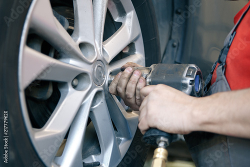 Car brake repairing in garage, automotive service station