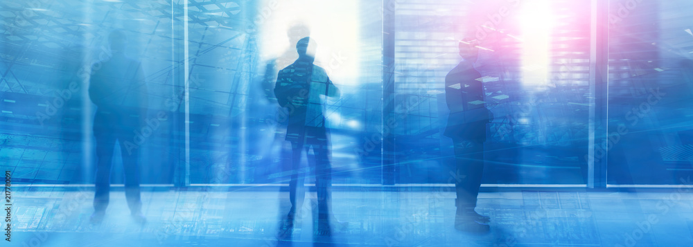 Silhouettes of people walking in the street near skyscrapers and modern office buildings. Multiple exposure blurred image. Economy, finances, business concept illustration. Conseptual. Silhouettes of people walking in the street near skyscrapers and modern office buildings. Multiple exposure blurred image. Economy, finances, business concept illustration. Conseptual.