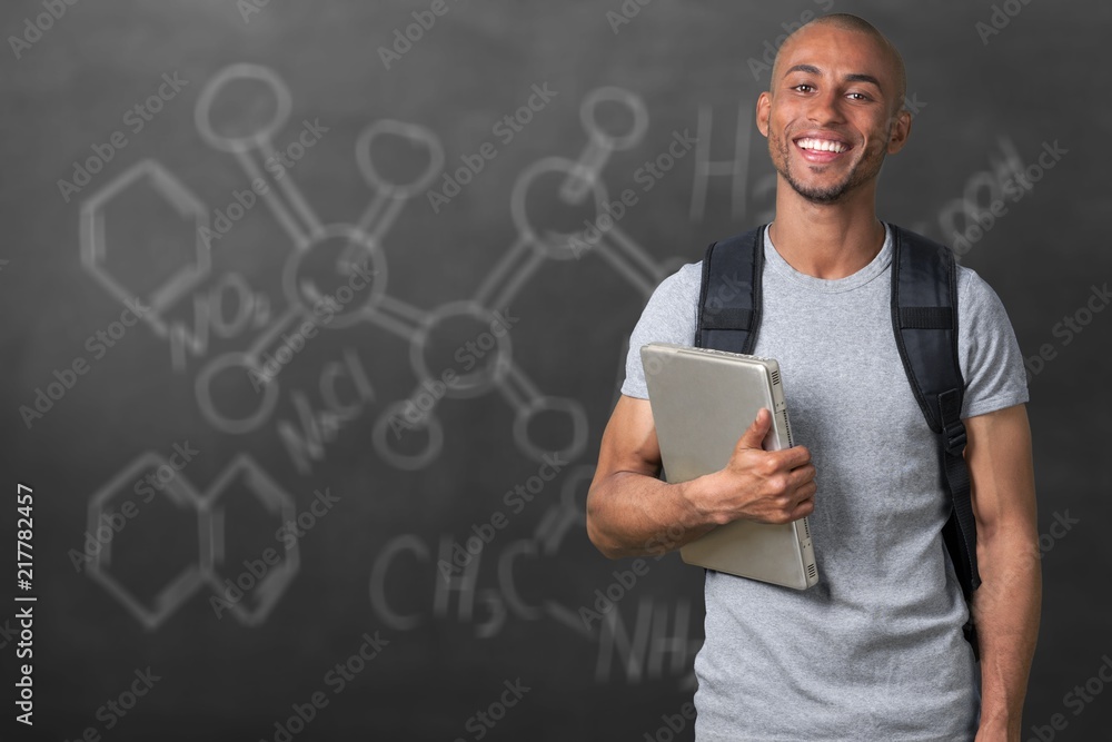 Smiling African Student man with laptop Smiling African Student man with laptop