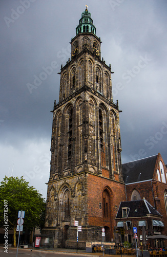 the beautiful Martinitower from Groningen in Netherlands. Background with dramatic clouds.