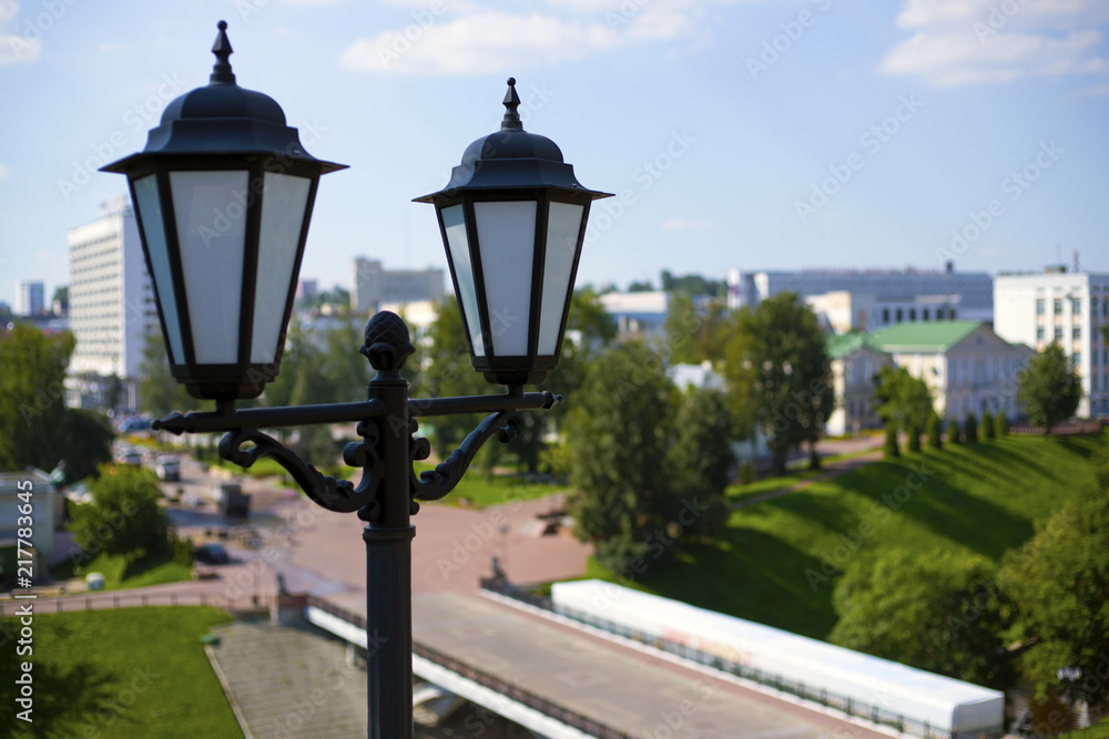 City lantern, against the backdrop of the urban landscape. Top view of the city.
