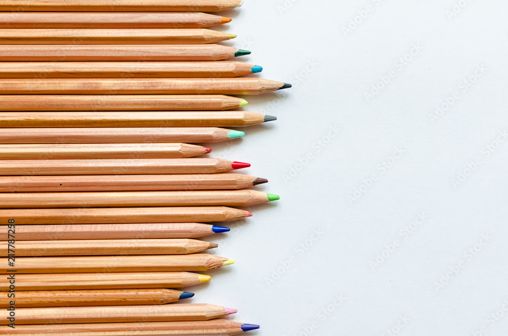 Obraz premium Wooden color pencils on white paper