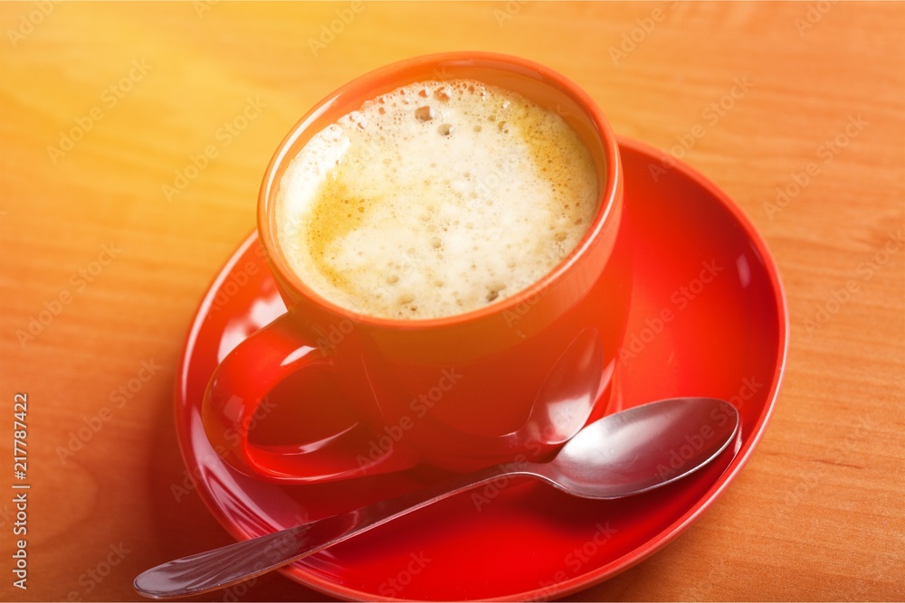 Coffee cup on desk Coffee cup on desk