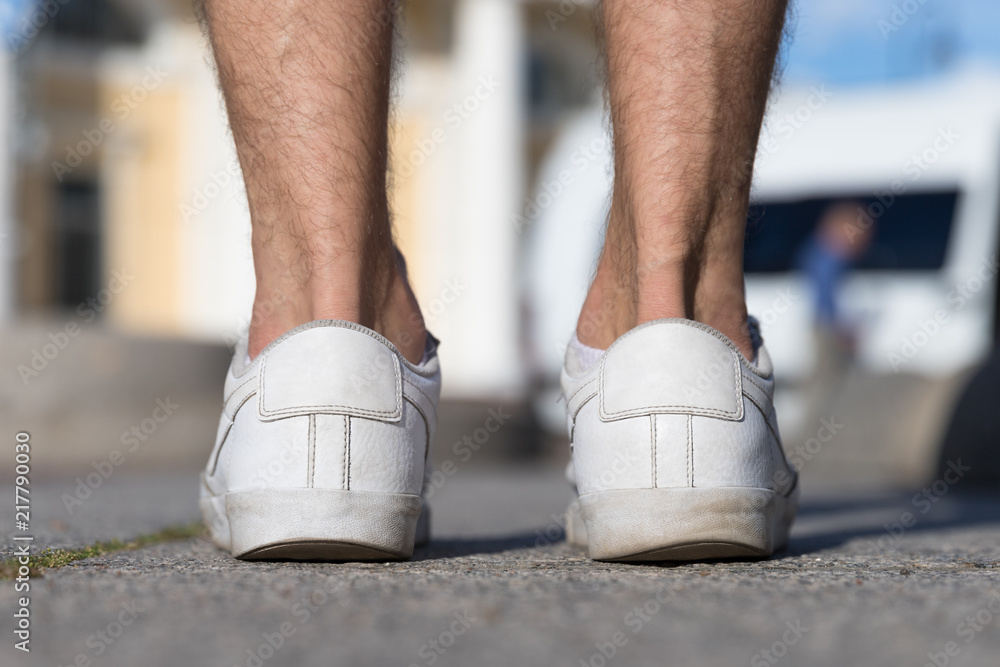 Flat foot, sole, posture concept. Irregular wear heel male shoes, closeup  back view outdoors, blurred background. Flat feet and fast wear of shoes  Photos | Adobe Stock