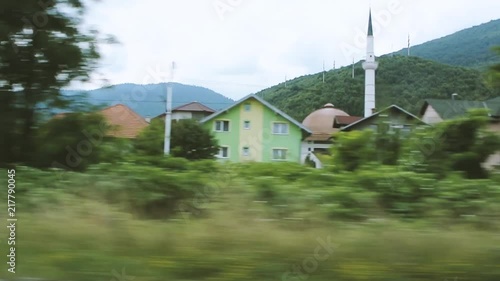 Hadzici Mosque and town houses and surrounding landscape photo