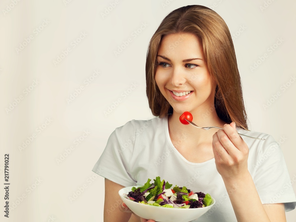 Attractive caucasian smiling woman with salad Attractive caucasian smiling woman with salad