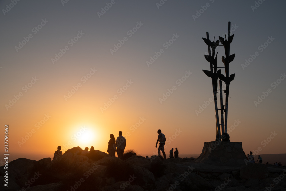 People enjoying their walk of Cape Greco cliff during the sunset 
