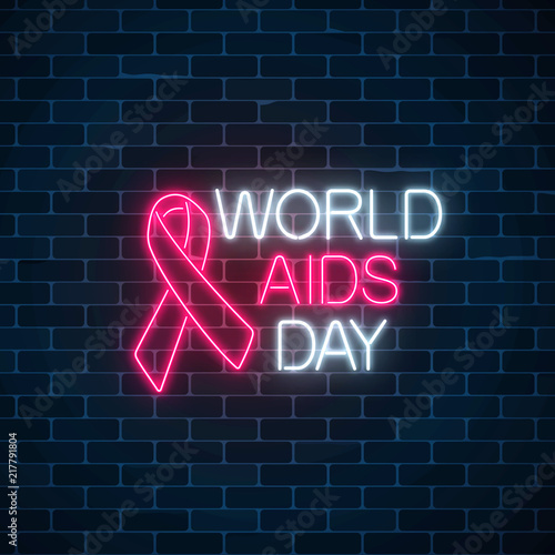 World Aids Day neon sign with red ribbon. Support for people living with HIV banner. 1st december world aids day symbol