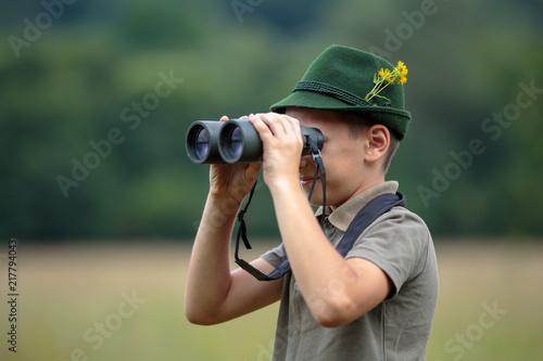 Little hunter with binoculars