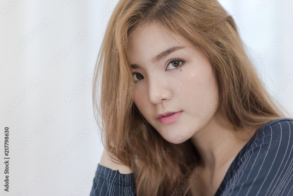 Close up of Young attractive Asian woman relaxing on vacation in room Close up of Young attractive Asian woman relaxing on vacation in room