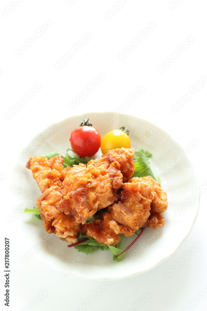 Homemade fried chicken served with cherry tomato Homemade fried chicken served with cherry tomato