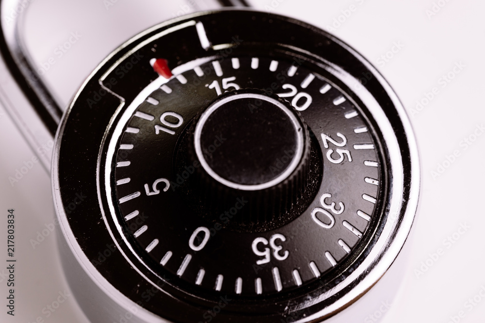 Safety or security concept, close up of code numbers on combination pad lock, locking device in which a sequence of symbols or numbers, is used to open the lock Safety or security concept, close up of code numbers on combination pad lock, locking device in which a sequence of symbols or numbers, is used to open the lock