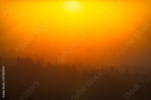 Smoke from the summer 2018 California wildfires glows under the setting sun