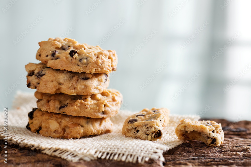 Pile of chocolate chip cookies on wooden desk. Pile of chocolate chip cookies on wooden desk.