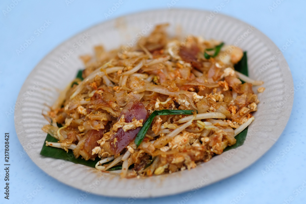 Penang famous hawker food stir fried noodles or called Char Koay Teow served on plate