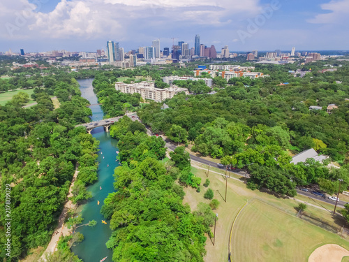 Aerial view Downtown from Barton Creek in Greenbelt at Zilker Metropolitan Park south Austin with summer blue cloud sky. Located at eastern edge of Hill Country, Austin the state capital of Texas, US. photo