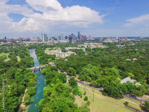 Aerial view Downtown from Barton Creek in Greenbelt at Zilker Metropolitan Park south Austin with summer blue cloud sky. Located at eastern edge of Hill Country, Austin the state capital of Texas, US. photo