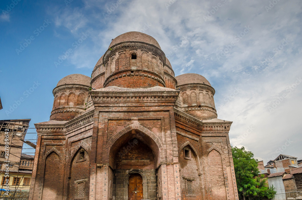 Graves surround the Tomb of Budshah, a popular tourist attraction in Srinagar, Kashmir, India.