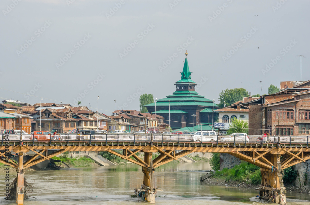 Srinagar, Jammu and Kashmir, India - July 4, 2017 : Old town Srinagar, ancient wooden and stone houses at Srinagar old city, Srinagar, Kashmir, India. Srinagar, Jammu and Kashmir, India - July 4, 2017 : Old town Srinagar, ancient wooden and stone houses at Srinagar old city, Srinagar, Kashmir, India.