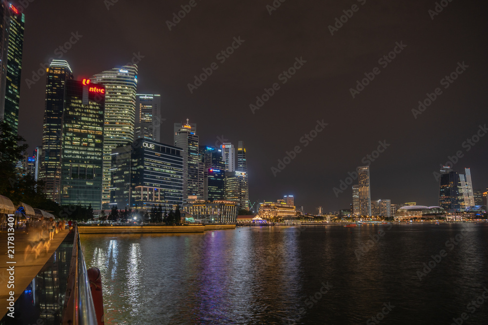 Singapore skyscraper with modern building around Marina bay at night 