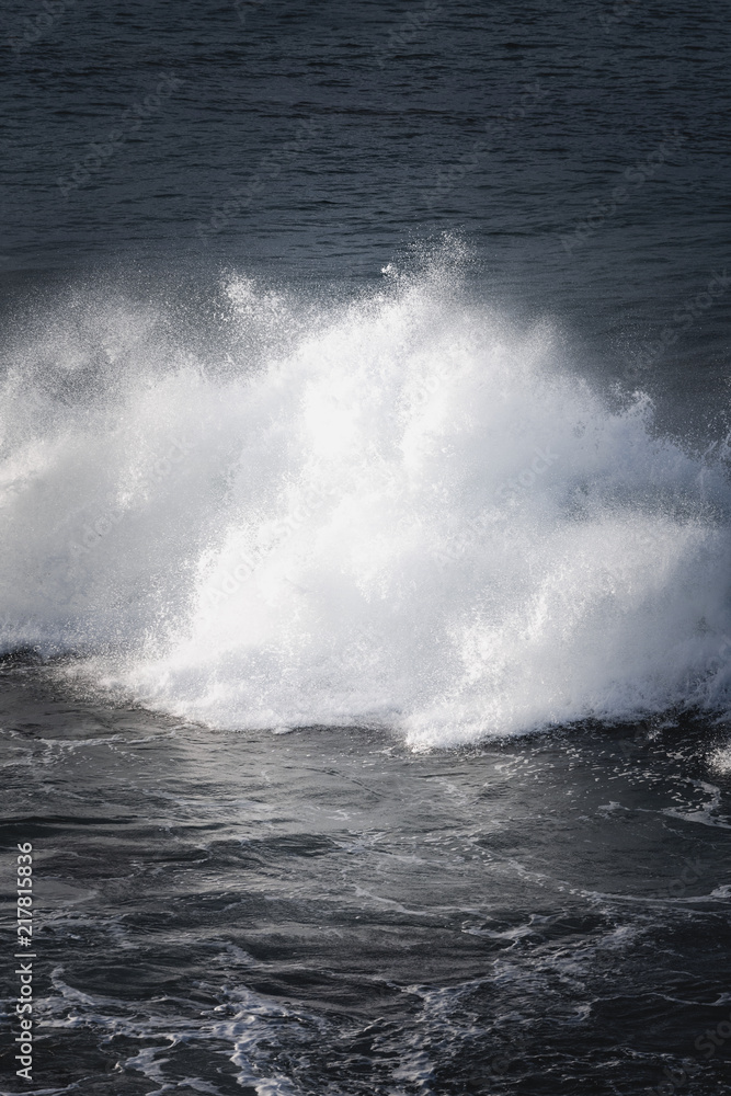 Fototapeta premium Waves and Rocks at Beach at Sunrise, 