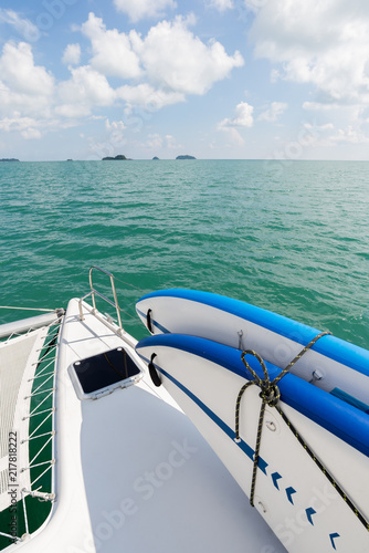 Sea series: SUP board with catamaran yacht