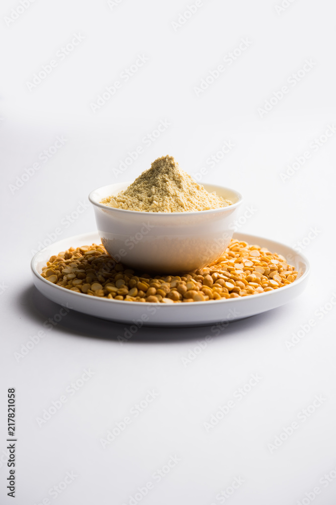 Besan, Gram or chickpea flour or powder is a pulse flour made from a variety of ground chickpea known as Bengal gram. popular ingredient for Pakora/pakoda or bajji snack. Selective focus Besan, Gram or chickpea flour or powder is a pulse flour made from a variety of ground chickpea known as Bengal gram. popular ingredient for Pakora/pakoda or bajji snack. Selective focus