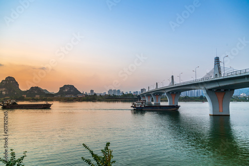 Bridges in the evening and cargo ships on the surface © 象波 张