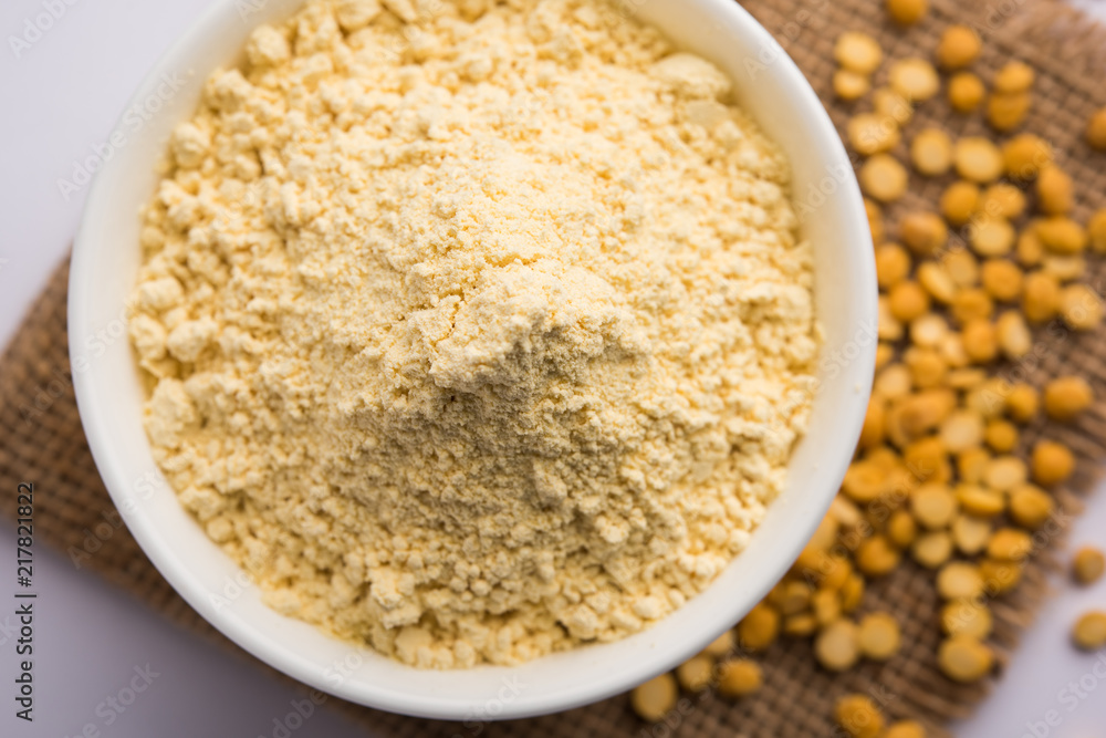 Besan, Gram or chickpea flour or powder is a pulse flour made from a variety of ground chickpea known as Bengal gram. popular ingredient for Pakora/pakoda or bajji snack. Selective focus Besan, Gram or chickpea flour or powder is a pulse flour made from a variety of ground chickpea known as Bengal gram. popular ingredient for Pakora/pakoda or bajji snack. Selective focus