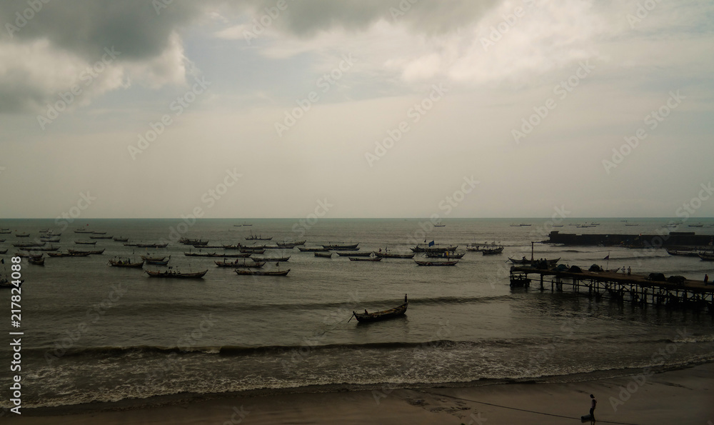 Panoramic view to Accra beach with the fishermans boat, Ghana