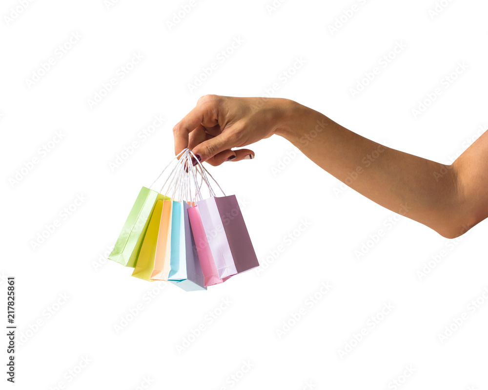 Hand isolated : A cropped female hand holding colorful shopping bags on white background include clipping path Easy to use for your work. Online shopping concept.
