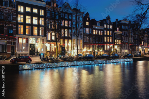 Light object named floating on a thousand memories  along the quay wall of the Herengracht during the Light Festival in Amsterdam