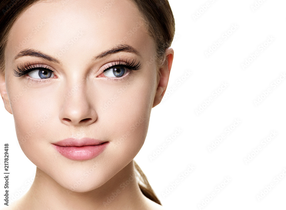 Beautiful brunette woman with beauty lashes and pink lipstick healthy skin isolated on white Beautiful brunette woman with beauty lashes and pink lipstick healthy skin isolated on white