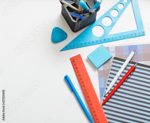 Collection of school supplies on white background photo