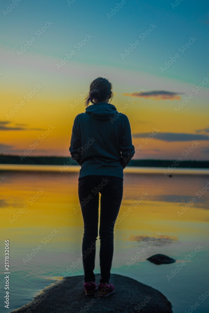 Silhouette of a girl watching sunset Silhouette of a girl watching sunset