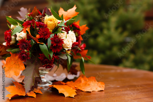 Fototapeta autumn flower composition with roses, chrysanthemum and maple leaves