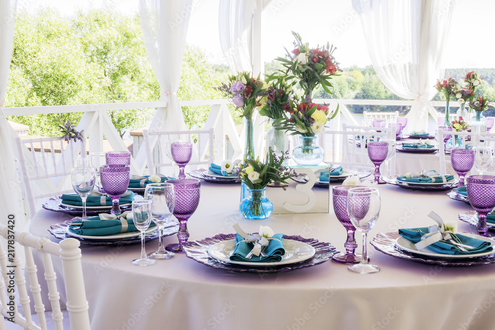 Wedding decoration. Wedding table decor in lavender and emerald